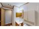 Bathroom featuring vanity, sink, cabinets, and shower accessed via an open door at 5824 Coventry Dr, Tampa, FL 33615