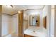 Bathroom with vanity, sink, mirror, cabinet, and shower/tub combination at 5824 Coventry Dr, Tampa, FL 33615