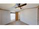 Bedroom featuring ceiling fan, window, and carpeted flooring at 5824 Coventry Dr, Tampa, FL 33615