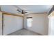 Cozy bedroom with ceiling fan, closet, window, and carpeted flooring at 5824 Coventry Dr, Tampa, FL 33615