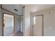 Bright hallway featuring modern lighting, new flooring and passage to other rooms at 5824 Coventry Dr, Tampa, FL 33615
