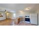 Open-concept kitchen with a mosaic countertop island, wood cabinets, and modern appliances at 5824 Coventry Dr, Tampa, FL 33615