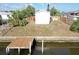 A shot of the back of the house, the yard, a new dock and canal at 5824 Coventry Dr, Tampa, FL 33615