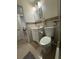 Bathroom featuring a tiled shower with glass door, vanity, toilet, mirrored medicine cabinet and tile floor at 5860 43Rd N Ter # 1518, Kenneth City, FL 33709