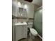 Bathroom featuring a tiled shower, vanity, toilet, and a mirrored medicine cabinet at 5860 43Rd N Ter # 1518, Kenneth City, FL 33709