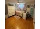 Cozy bedroom with hardwood floors, ample storage, and natural light at 5860 43Rd N Ter # 1518, Kenneth City, FL 33709