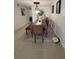 Dining room features modern table, artwork, tile flooring and a functional robot vacuum at 5860 43Rd N Ter # 1518, Kenneth City, FL 33709