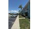 Exterior of building featuring ample parking and palm tree landscaping at 5860 43Rd N Ter # 1518, Kenneth City, FL 33709