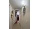 Hallway with decorative wall art leading to a bedroom at 5860 43Rd N Ter # 1518, Kenneth City, FL 33709