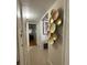 Hallway with tiled floors and unique metal wall decor at 5860 43Rd N Ter # 1518, Kenneth City, FL 33709