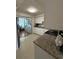 Kitchen with granite countertops and stainless appliances next to breakfast nook at 5860 43Rd N Ter # 1518, Kenneth City, FL 33709