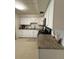 Bright kitchen showcasing ample cabinet space and granite countertops at 5860 43Rd N Ter # 1518, Kenneth City, FL 33709
