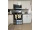 Stainless steel oven and microwave accent the light, bright kitchen at 5860 43Rd N Ter # 1518, Kenneth City, FL 33709