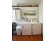 Well-lit laundry area with modern washer and dryer, plus storage at 5860 43Rd N Ter # 1518, Kenneth City, FL 33709