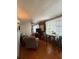 Cozy living room with wood flooring, natural light, and comfortable seating at 5860 43Rd N Ter # 1518, Kenneth City, FL 33709