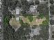 Aerial view showcasing the property layout, including the main house and a detached garage at 5926 Frontier Dr, Zephyrhills, FL 33540