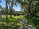 Long driveway leads to steel structure at 5926 Frontier Dr, Zephyrhills, FL 33540