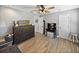 Another view of this well-appointed bedroom showing a ceiling fan and floors at 5926 Frontier Dr, Zephyrhills, FL 33540