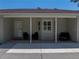 Inviting covered porch with seating, providing a comfortable outdoor living space with shade at 5926 Frontier Dr, Zephyrhills, FL 33540