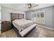 Bedroom with neutral decor, plantation shutters, and a ceiling fan for added comfort at 5926 Frontier Dr, Zephyrhills, FL 33540