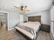 Bedroom features neutral walls, a ceiling fan, and plantation shutters that provide ample natural light at 5926 Frontier Dr, Zephyrhills, FL 33540