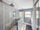 Open concept shower features a rain shower head and glass enclosure at 5926 Frontier Dr, Zephyrhills, FL 33540