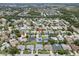 Community aerial view showcasing lush landscaping, mature trees, and multiple single Gathering homes at 6009 Cedarwood Ln, Bradenton, FL 34203