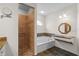 Bathroom featuring granite countertops, a vanity, a shower, and a separate tub at 6009 Cedarwood Ln, Bradenton, FL 34203