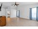 Spacious bedroom with light floors, large windows, ceiling fan, and ample closet space at 6009 Cedarwood Ln, Bradenton, FL 34203