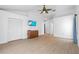 Spacious bedroom with light floors, large windows, ceiling fan, and ample closet space at 6009 Cedarwood Ln, Bradenton, FL 34203