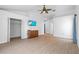 Spacious bedroom with light floors, large windows, ceiling fan, and ample closet space at 6009 Cedarwood Ln, Bradenton, FL 34203