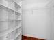 Walk-in closet with built-in shelving, providing ample storage space at 6009 Cedarwood Ln, Bradenton, FL 34203