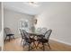 Bright dining room with a modern table set and a large window at 6009 Cedarwood Ln, Bradenton, FL 34203