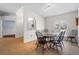 Bright dining room featuring light wood floors and modern lighting fixtures at 6009 Cedarwood Ln, Bradenton, FL 34203