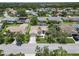 Beautiful single-Gathering home featuring lush landscaping, mature trees, and a well-manicured lawn at 6009 Cedarwood Ln, Bradenton, FL 34203