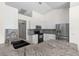 Modern kitchen featuring stainless steel appliances and granite countertops at 6009 Cedarwood Ln, Bradenton, FL 34203