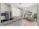 Cozy kitchen featuring granite countertops and stainless steel appliances at 6009 Cedarwood Ln, Bradenton, FL 34203