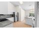 Bright kitchen featuring granite countertops and stainless steel appliances at 6009 Cedarwood Ln, Bradenton, FL 34203