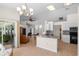 Open concept kitchen and living area with a view of the outdoor patio at 6009 Cedarwood Ln, Bradenton, FL 34203