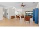 Bright living room featuring skylights, ceiling fan, and wood-look floors at 6009 Cedarwood Ln, Bradenton, FL 34203