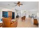 Spacious living room with ceiling fan and neutral tones leading to the dining area at 6009 Cedarwood Ln, Bradenton, FL 34203