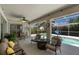 Inviting screened-in patio with pool views and comfortable seating area at 6009 Cedarwood Ln, Bradenton, FL 34203