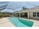 Screened pool area featuring a sparkling pool, ample seating, and serene outdoor living space at 6009 Cedarwood Ln, Bradenton, FL 34203