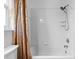 Bathtub and shower combo featuring a shower curtain and a shower head at 6009 Cedarwood Ln, Bradenton, FL 34203