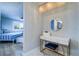 Bathroom vanity area with attractive decor, including a vanity table and statement lighting fixture at 601 2Nd St, Indian Rocks Beach, FL 33785