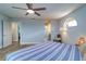 Comfortable bedroom with soft lighting, light blue walls, and easy access to the ensuite bath at 601 2Nd St, Indian Rocks Beach, FL 33785