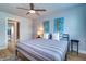 This bedroom offers decor with two seahorse wall hangings and a comfortable bed with striped comforter at 601 2Nd St, Indian Rocks Beach, FL 33785