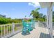Outdoor deck boasts tropical landscape views with seating for lounging at 601 2Nd St, Indian Rocks Beach, FL 33785