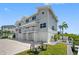 Lovely waterfront townhome with a beautiful manicured lawn, docks, and 3 car garage at 601 2Nd St, Indian Rocks Beach, FL 33785