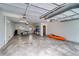 Bright and spacious garage featuring a kayak, ping pong table, and storage shelves at 601 2Nd St, Indian Rocks Beach, FL 33785